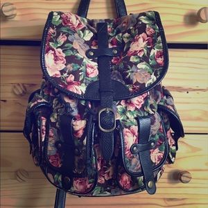 Black floral backpack with many pockets